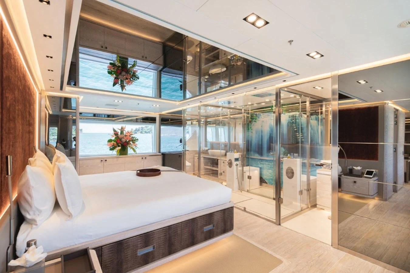 The master stateroom features a luxurious bed and a spacious, modern design with ample natural light. aboard PICK UP Yacht for Sale