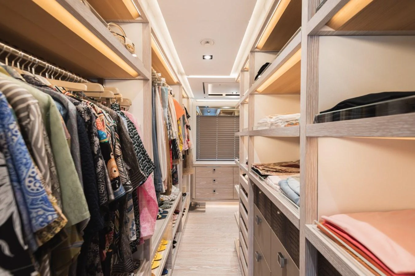 A spacious and well-organized walk-in closet with ample storage for clothing and accessories. aboard PICK UP Yacht for Sale