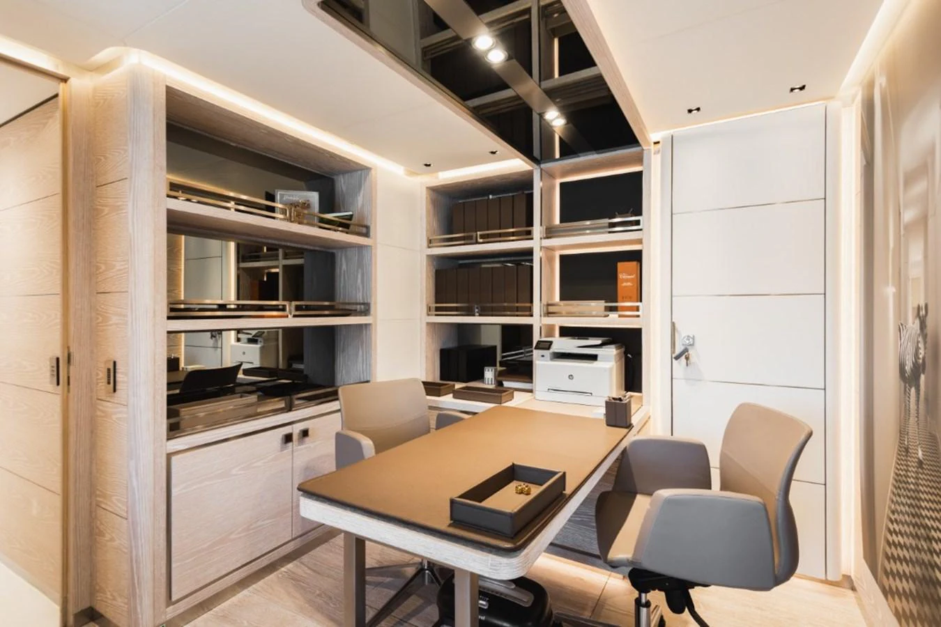 The yacht features a modern and well-appointed office space with ample storage and sleek furnishings. aboard PICK UP Yacht for Sale