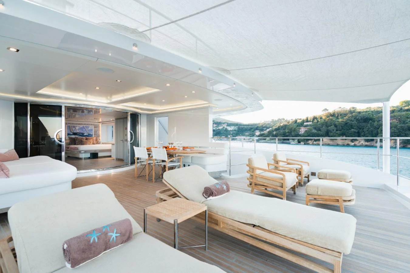 The aft deck offers a luxurious outdoor lounging and dining area with stunning views. aboard PICK UP Yacht for Sale