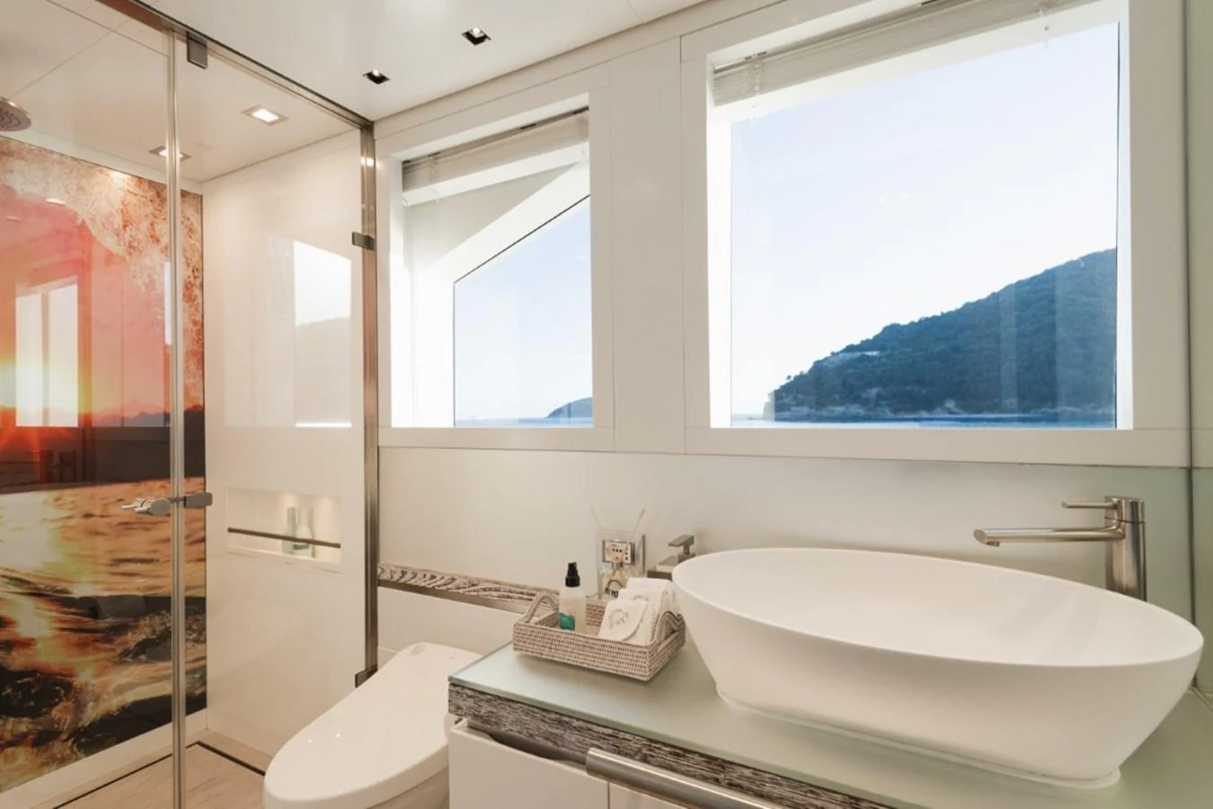 A luxurious yacht bathroom with modern fixtures and a scenic view through the windows. aboard PICK UP Yacht for Sale