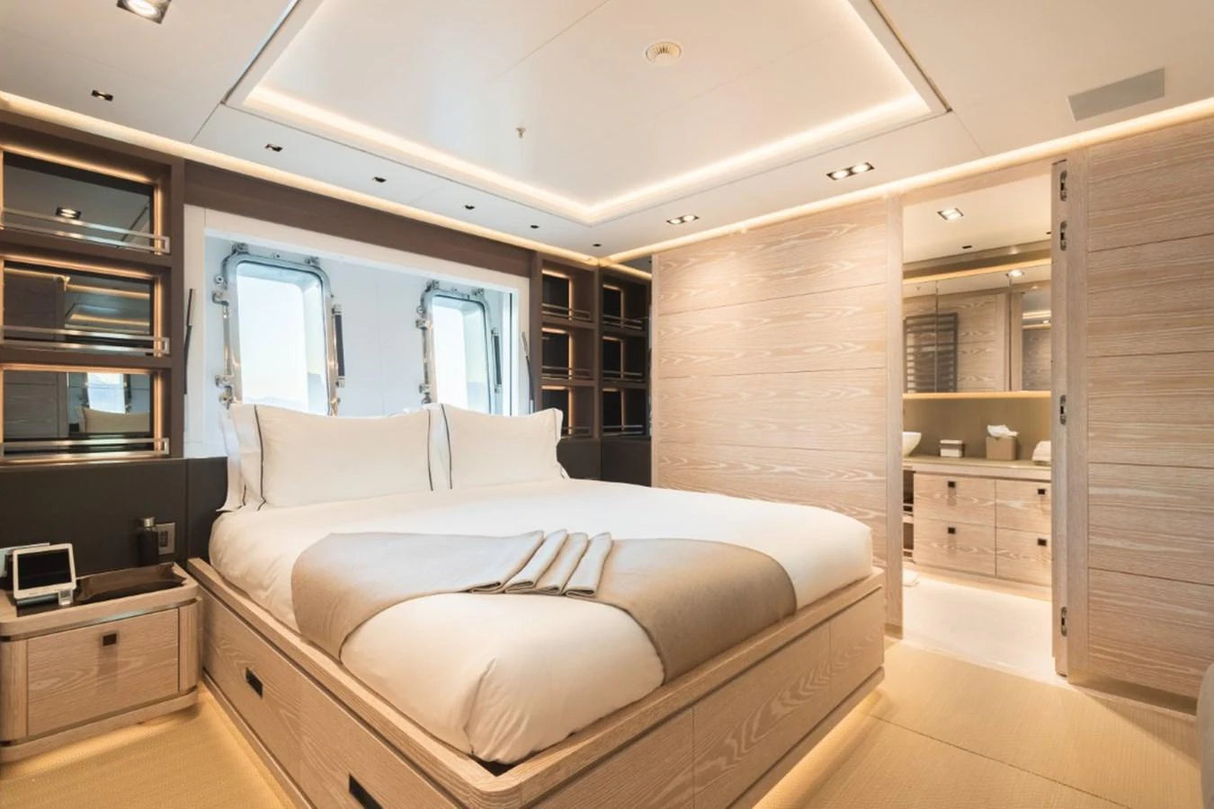 The master stateroom features a spacious bed, elegant lighting, and a luxurious ensuite bathroom. aboard PICK UP Yacht for Sale