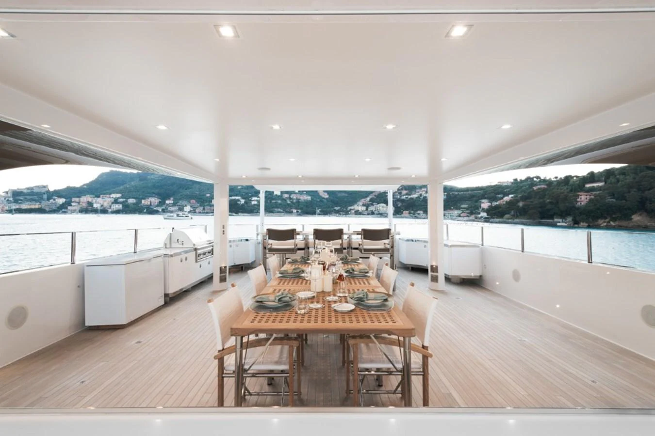 The aft deck features an elegant dining area with a stunning view of the surrounding waters. aboard PICK UP Yacht for Sale