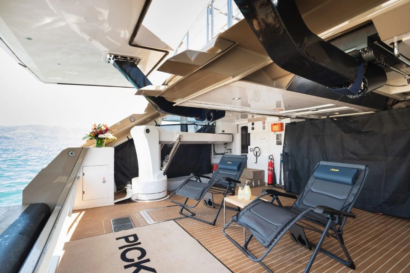 The aft deck features comfortable lounge chairs and a well-shaded area for relaxation. aboard PICK UP Yacht for Sale