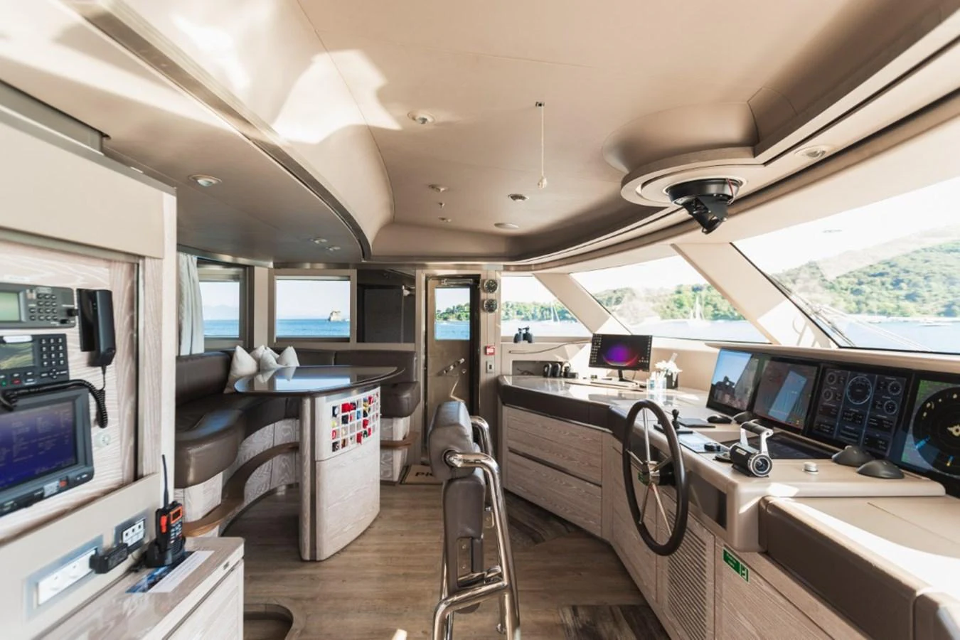 The helm station features advanced navigation equipment and a panoramic view through large windows. aboard PICK UP Yacht for Sale