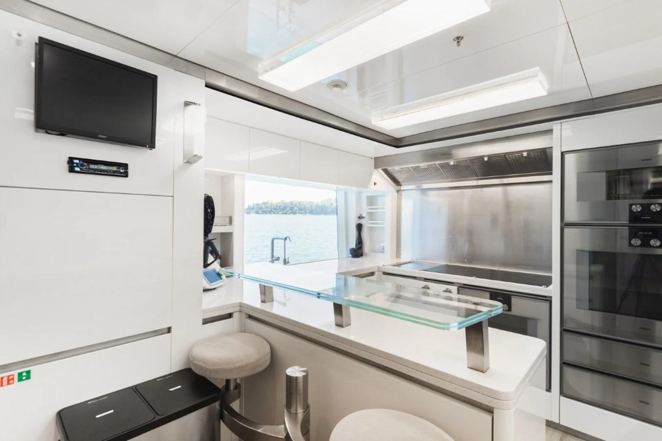 The modern galley features sleek appliances and a view of the water. aboard PICK UP Yacht for Sale