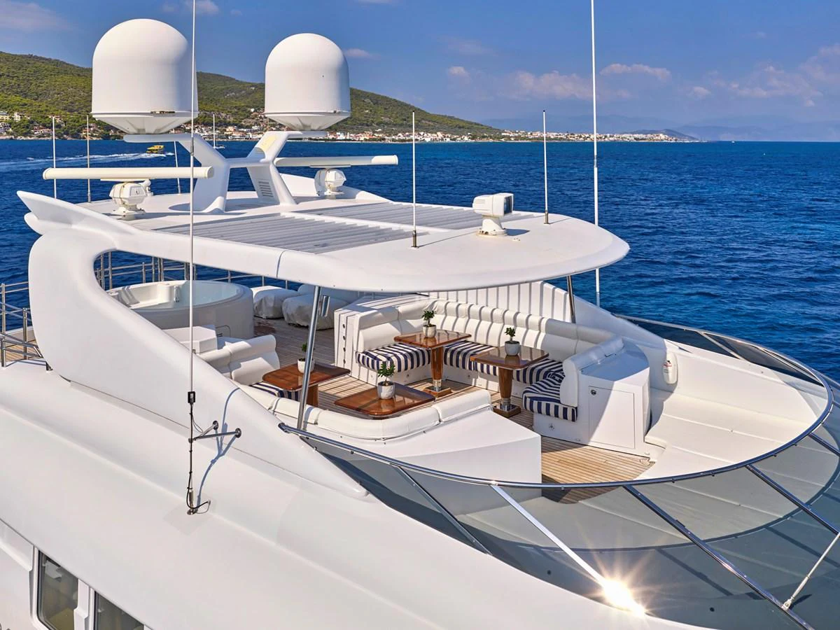 The yacht's flybridge offers a luxurious outdoor seating area with panoramic ocean views. aboard BILMAR Yacht for Sale