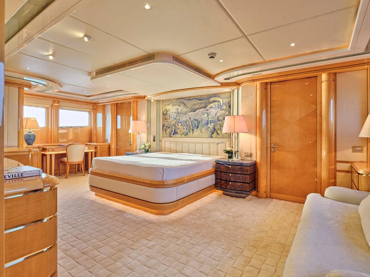 The master stateroom exudes luxury with its spacious layout, elegant furnishings, and warm lighting. aboard BILMAR Yacht for Sale