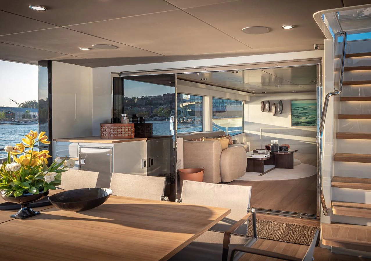 The yacht's salon offers a luxurious and inviting space with comfortable seating and elegant decor. aboard NUMARINE 27XP#6 Yacht for Sale