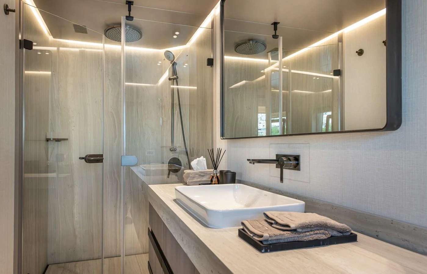 The yacht's bathroom features a modern design with sleek fixtures and ample lighting. aboard NUMARINE 27XP#6 Yacht for Sale