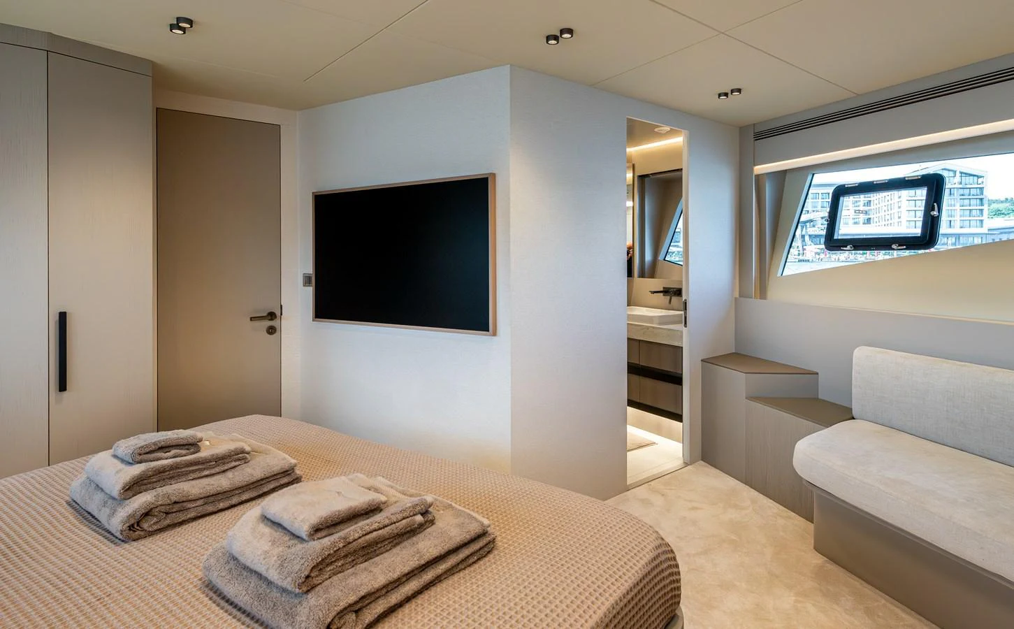 The stateroom features a comfortable bed, modern decor, and an en-suite bathroom. aboard NUMARINE 27XP#6 Yacht for Sale