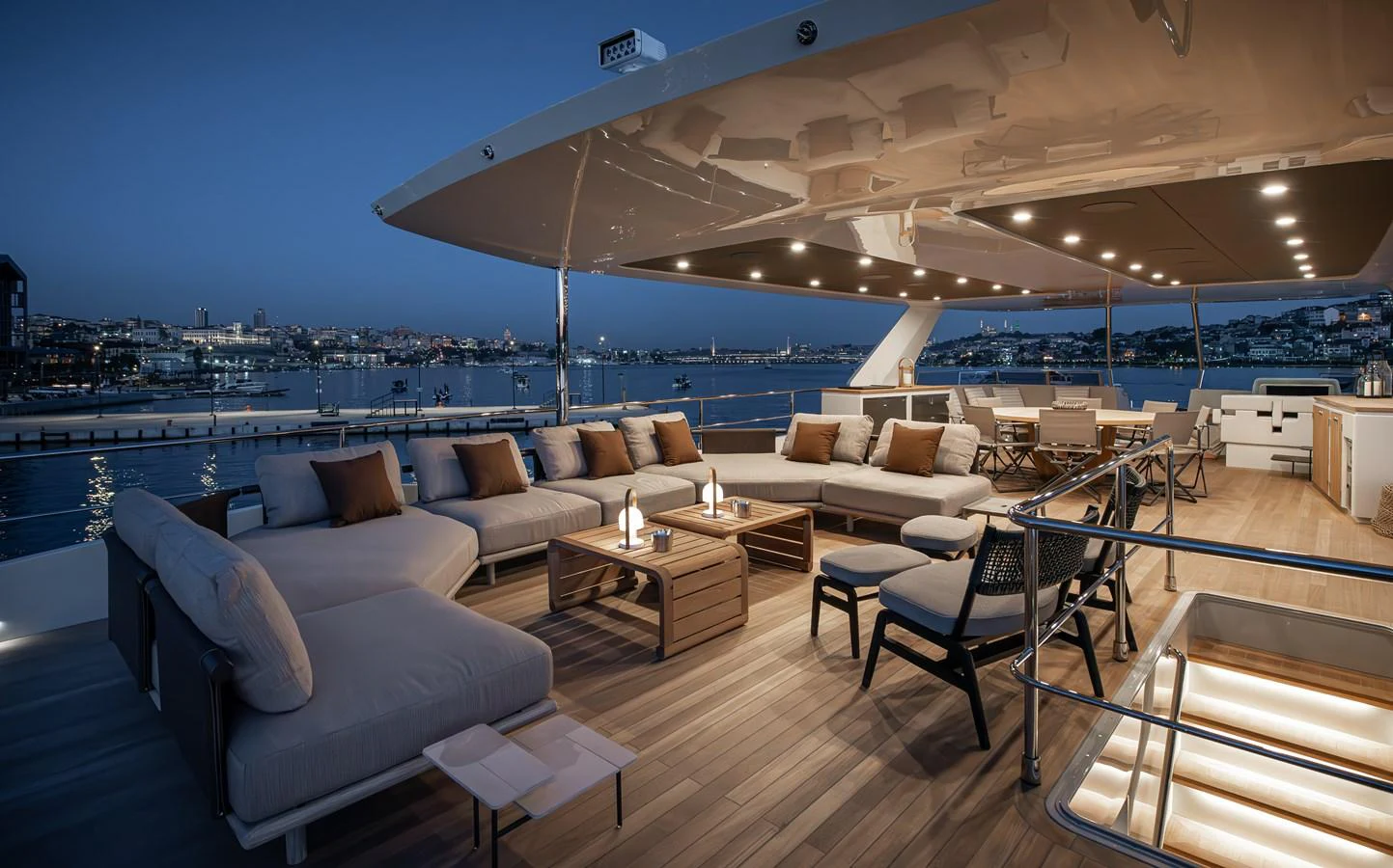The sundeck offers a luxurious outdoor lounging area with ample seating and ambient lighting, perfect for evening relaxation. aboard NUMARINE 27XP#6 Yacht for Sale