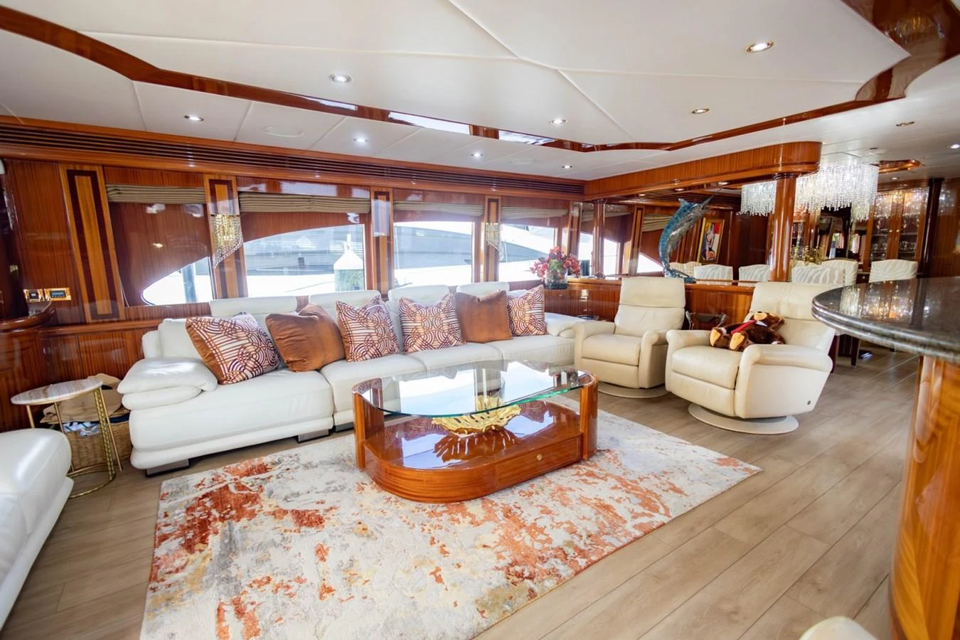 The salon features luxurious seating with elegant wood finishes and a stylish decor. aboard MY ANGEL Yacht for Sale