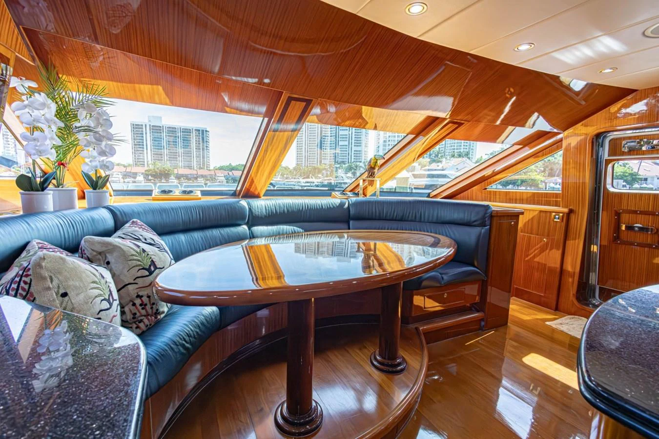The salon features a luxurious seating area with panoramic windows offering stunning views. aboard MY ANGEL Yacht for Sale