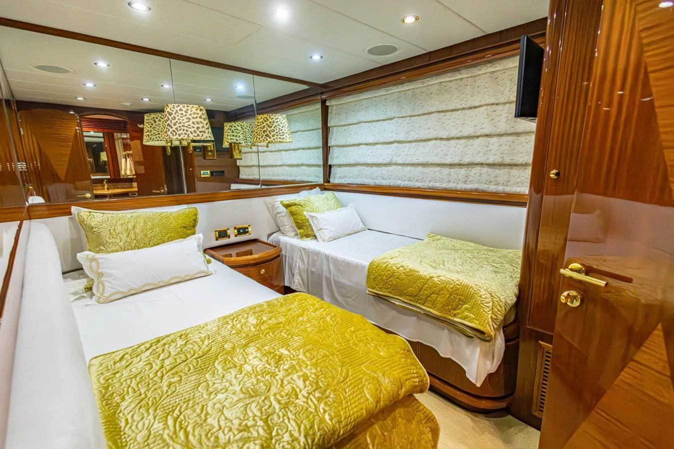 The guest stateroom features twin beds with luxurious bedding and elegant wood finishes. aboard MY ANGEL Yacht for Sale