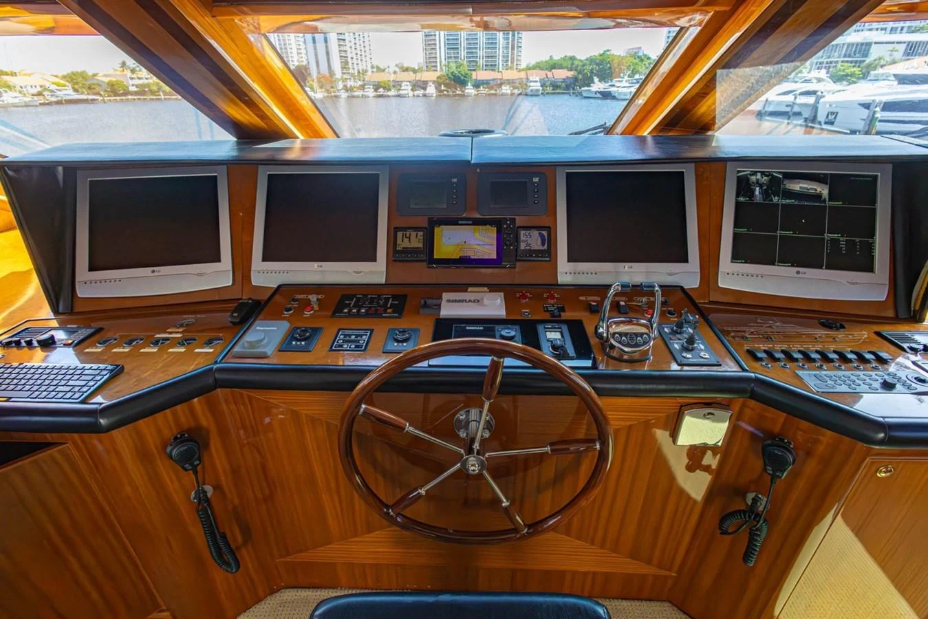 The helm station features advanced navigation equipment and luxurious wood finishes. aboard MY ANGEL Yacht for Sale