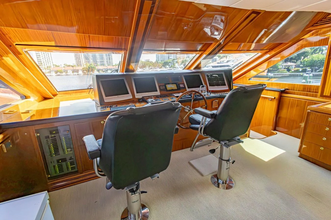 The helm station features luxurious wood finishes and state-of-the-art navigation equipment. aboard MY ANGEL Yacht for Sale