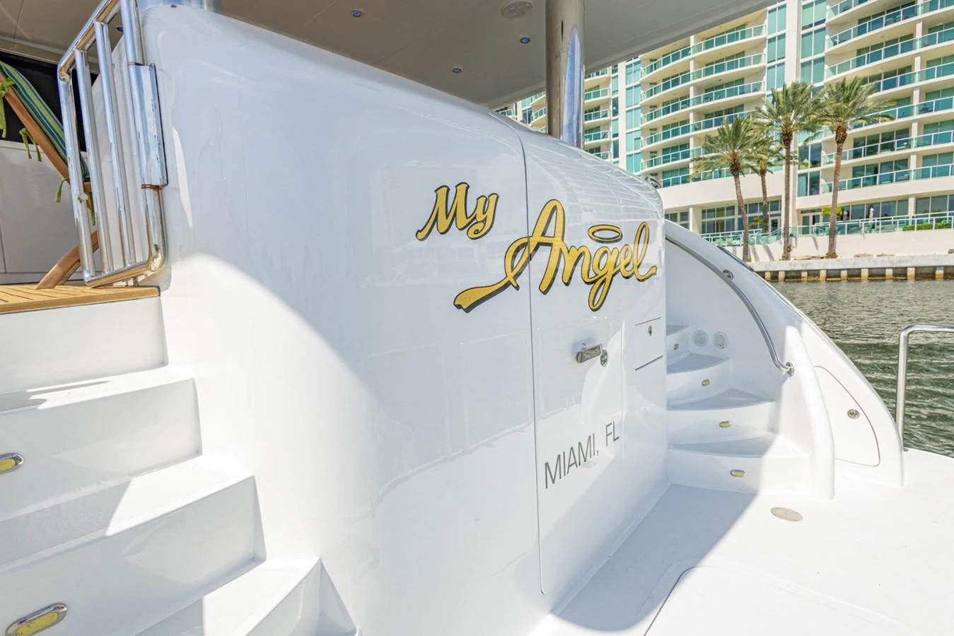 The yacht's name and home port are elegantly displayed on its pristine white exterior. aboard MY ANGEL Yacht for Sale