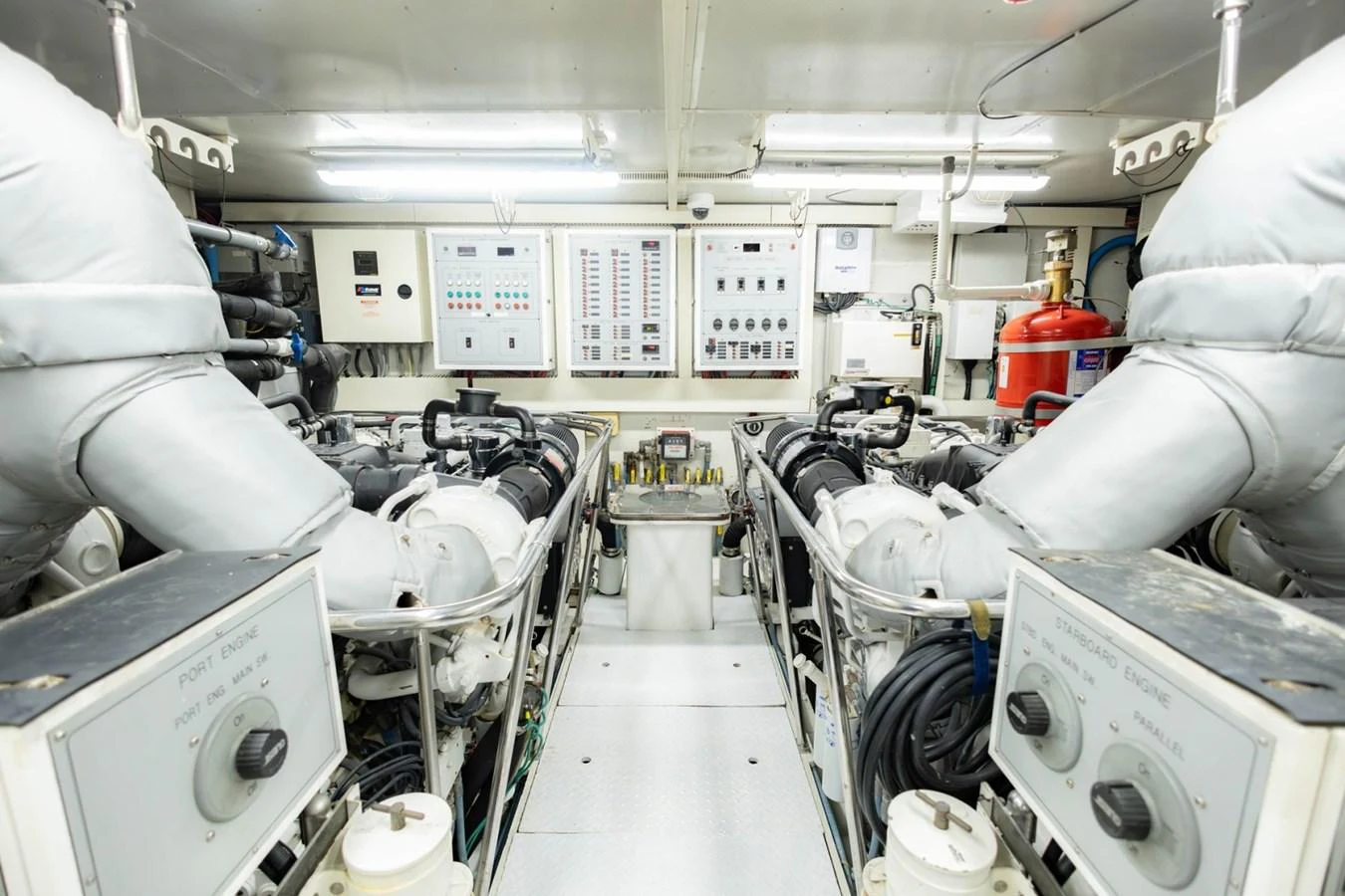 The engine room showcases a well-maintained and organized space with advanced machinery and control panels. aboard MY ANGEL Yacht for Sale