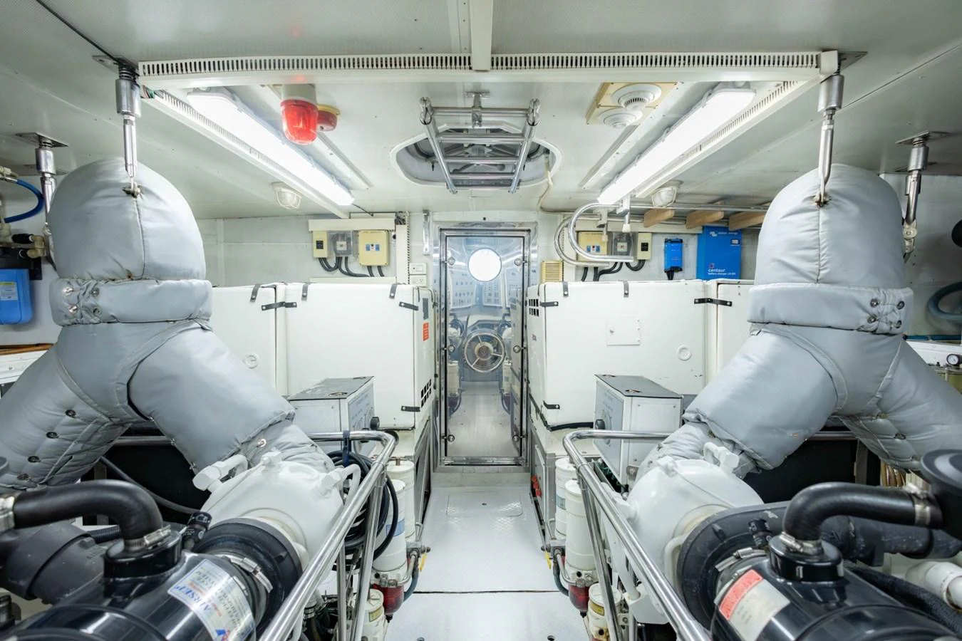 The engine room is meticulously organized, showcasing advanced machinery and clean surroundings. aboard MY ANGEL Yacht for Sale