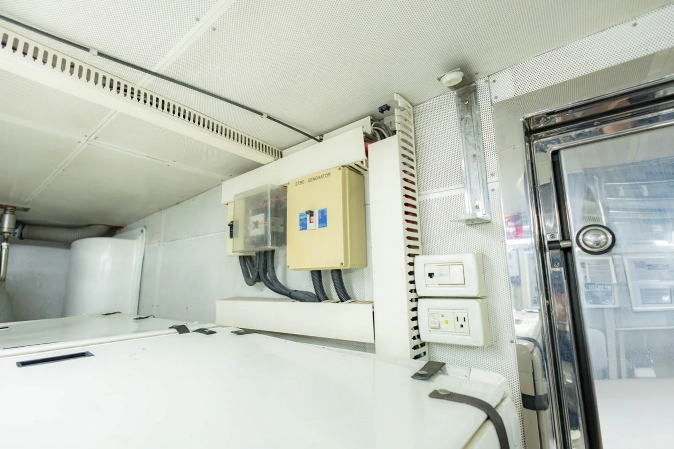 A detailed view of the yacht's electrical control panel and surrounding equipment. aboard MY ANGEL Yacht for Sale