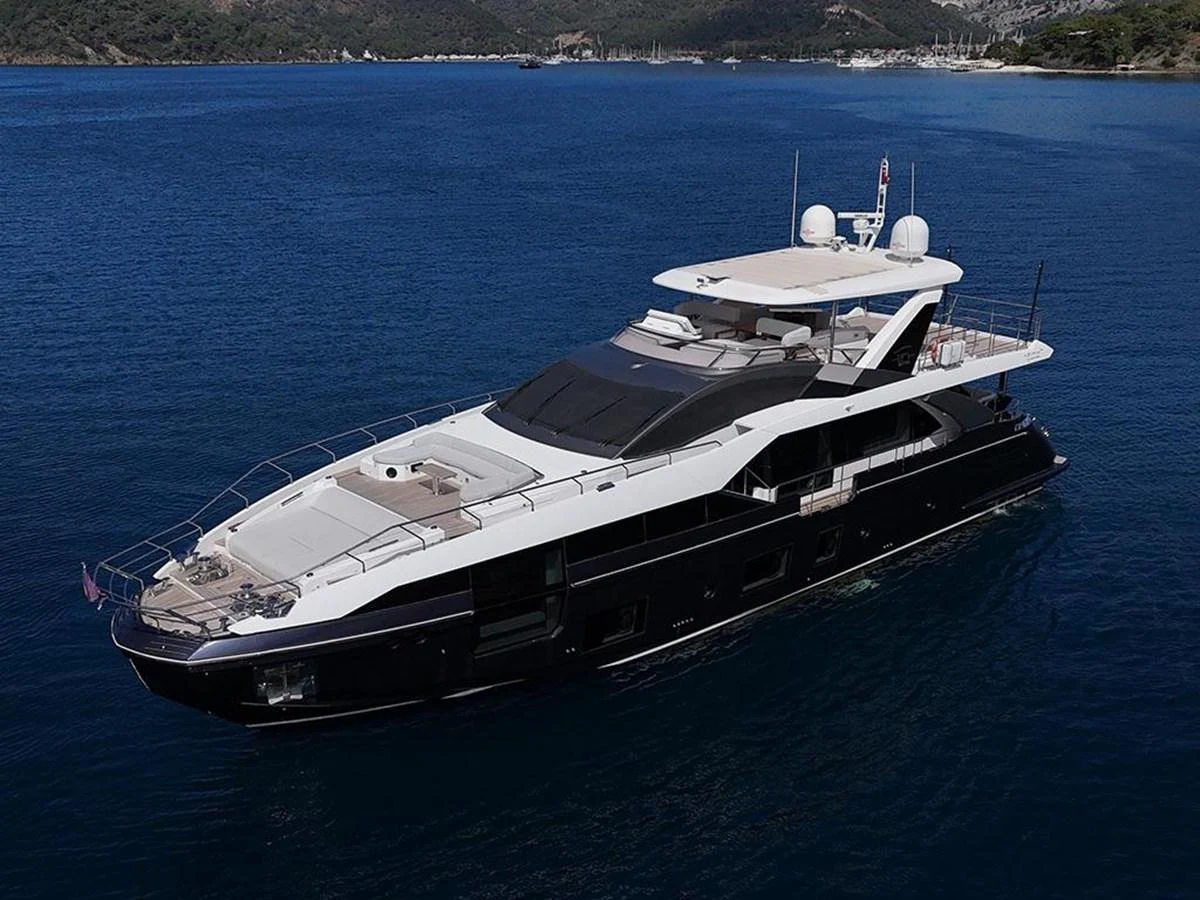 A sleek and modern yacht glides gracefully on calm blue waters, showcasing its luxurious design and spacious decks. aboard ALEX10 Yacht for Sale