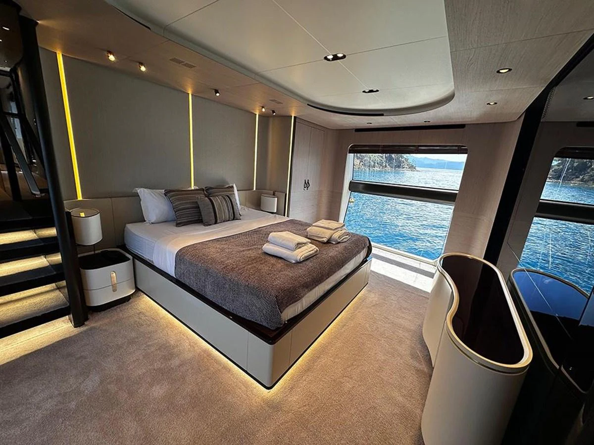 The master stateroom offers a luxurious and serene retreat with stunning ocean views. aboard ALEX10 Yacht for Sale
