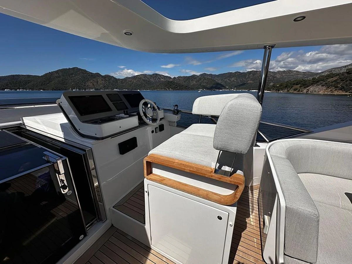 The flybridge offers a comfortable seating area with stunning views of the surrounding waters. aboard ALEX10 Yacht for Sale