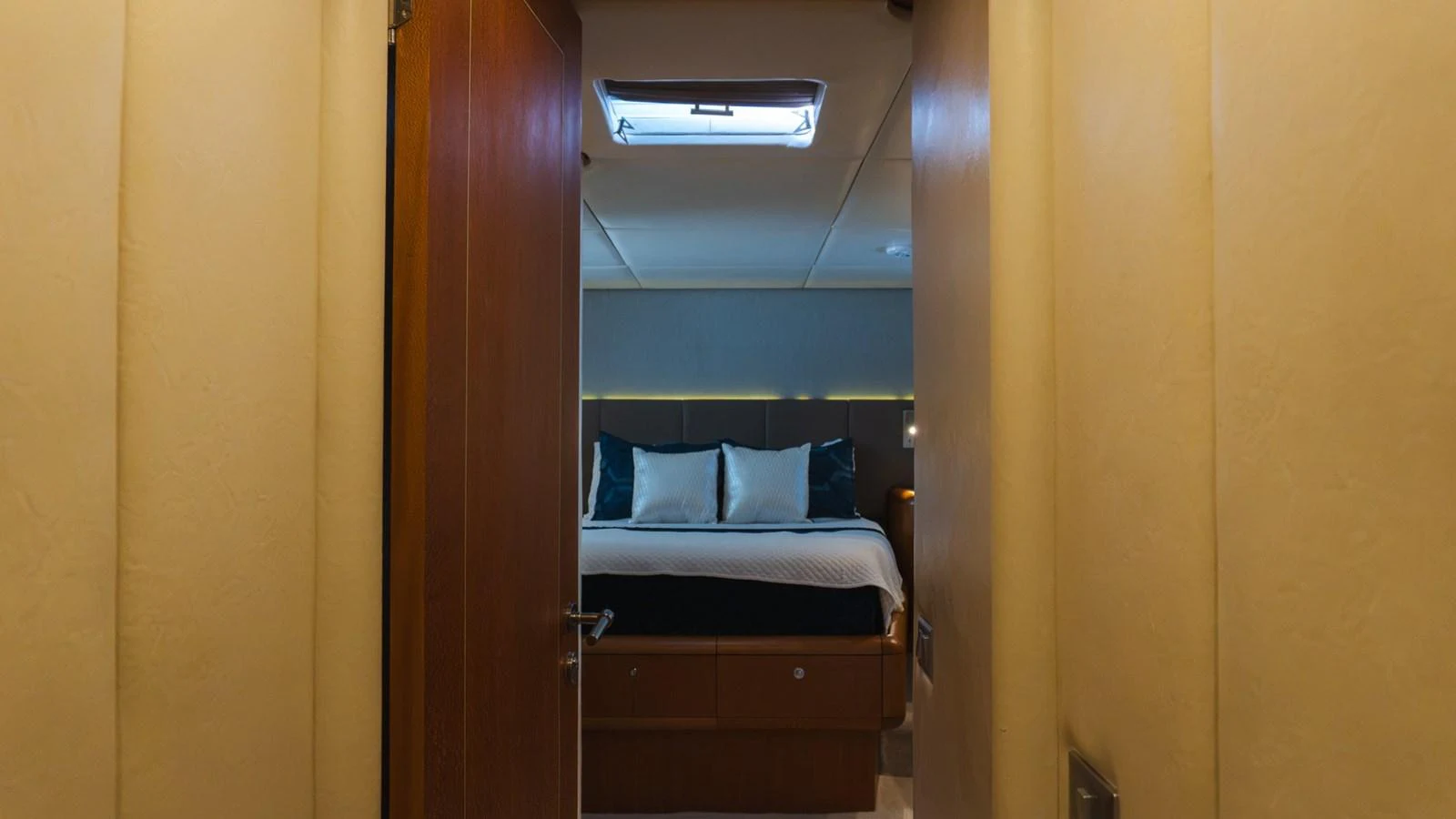 A cozy stateroom with a comfortable bed and soft lighting. aboard AUSSIE RULES Yacht for Sale