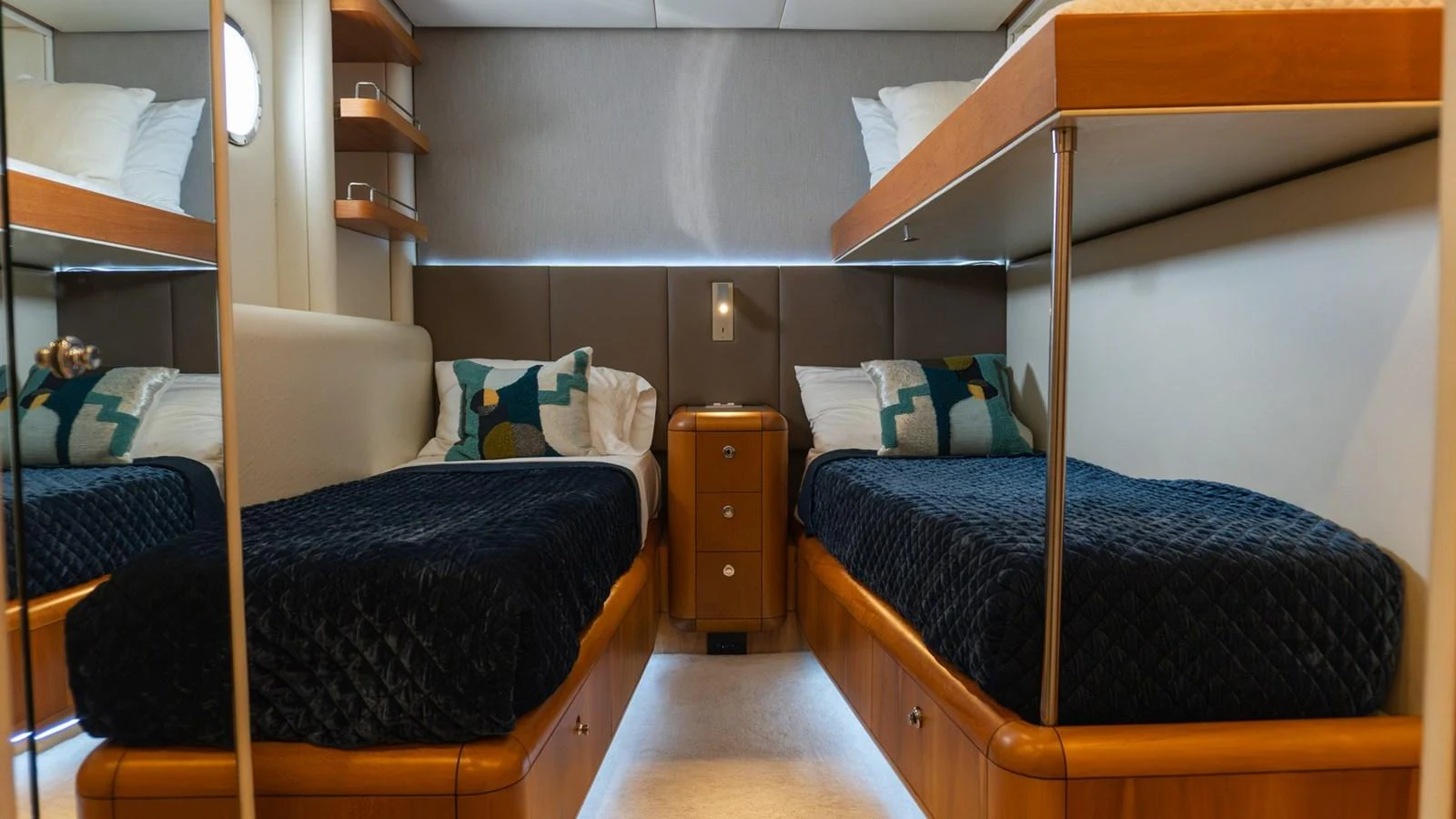 The twin stateroom features two single beds with plush bedding and modern decor. aboard AUSSIE RULES Yacht for Sale