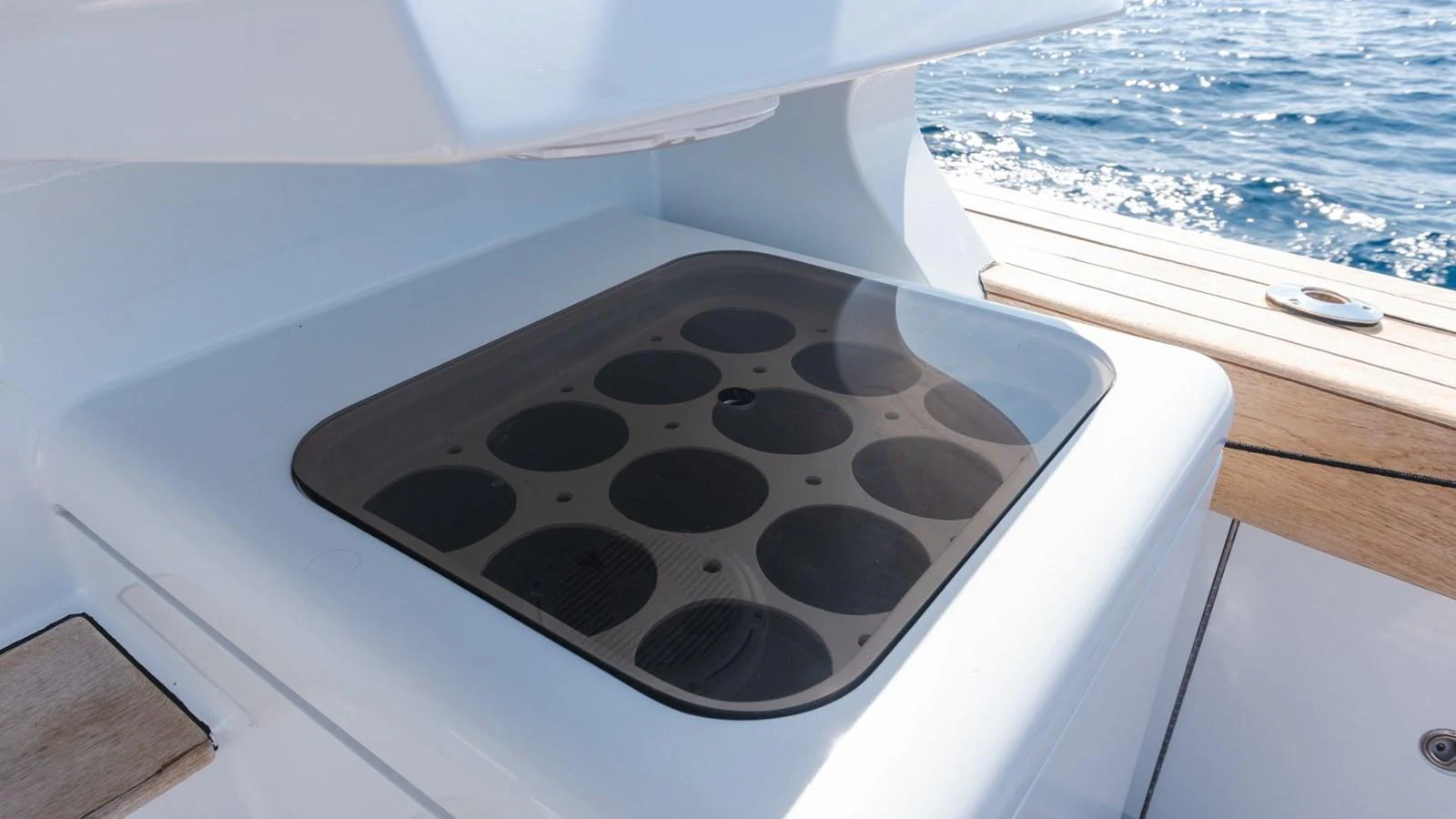 A close-up of a yacht's built-in grill on the deck, with the ocean in the background. aboard AUSSIE RULES Yacht for Sale