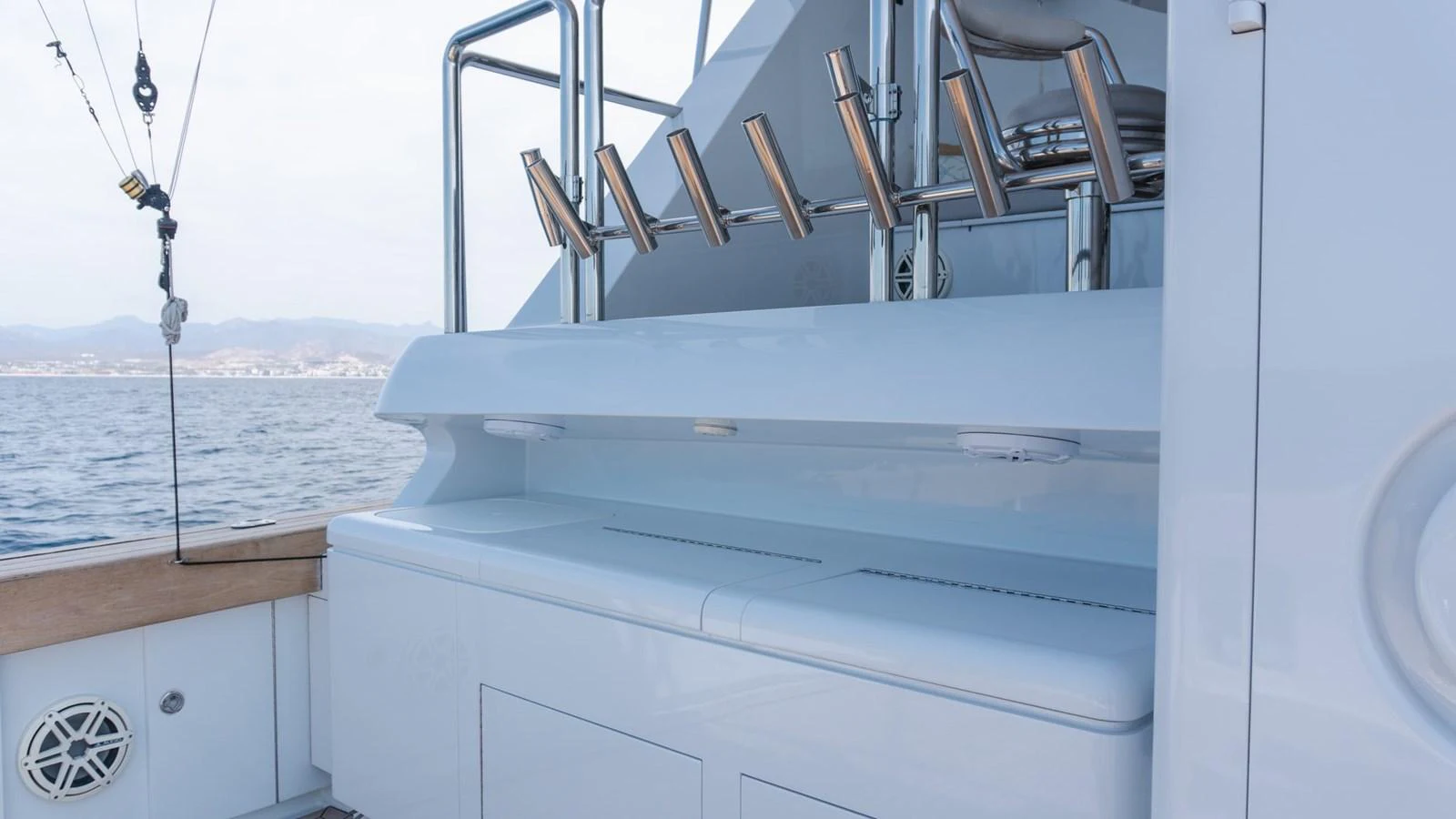 The image showcases a sleek fishing station on the yacht, equipped with multiple rod holders and ample storage space. aboard AUSSIE RULES Yacht for Sale
