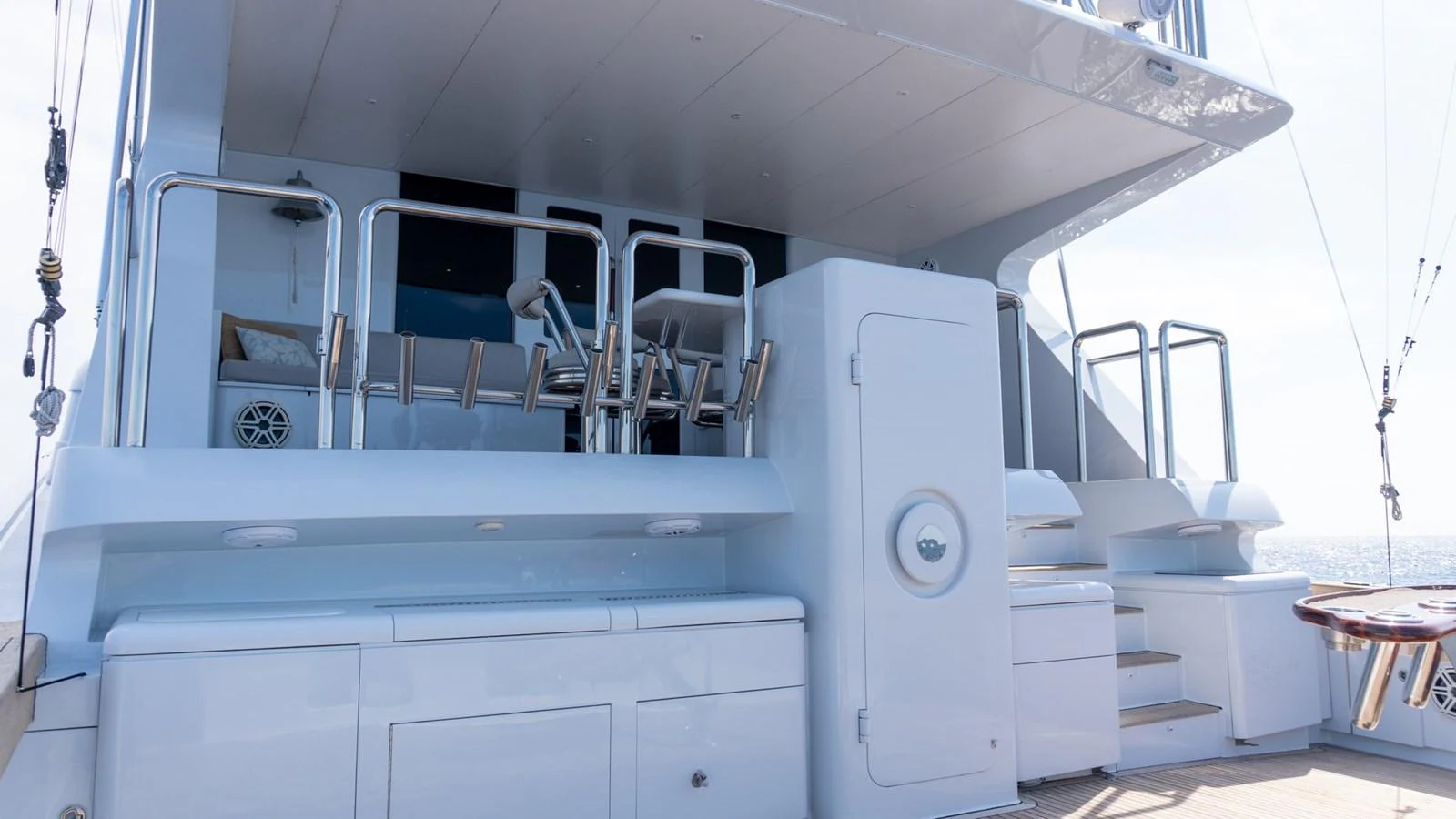 The aft deck features a clean and functional layout with ample storage and fishing equipment. aboard AUSSIE RULES Yacht for Sale
