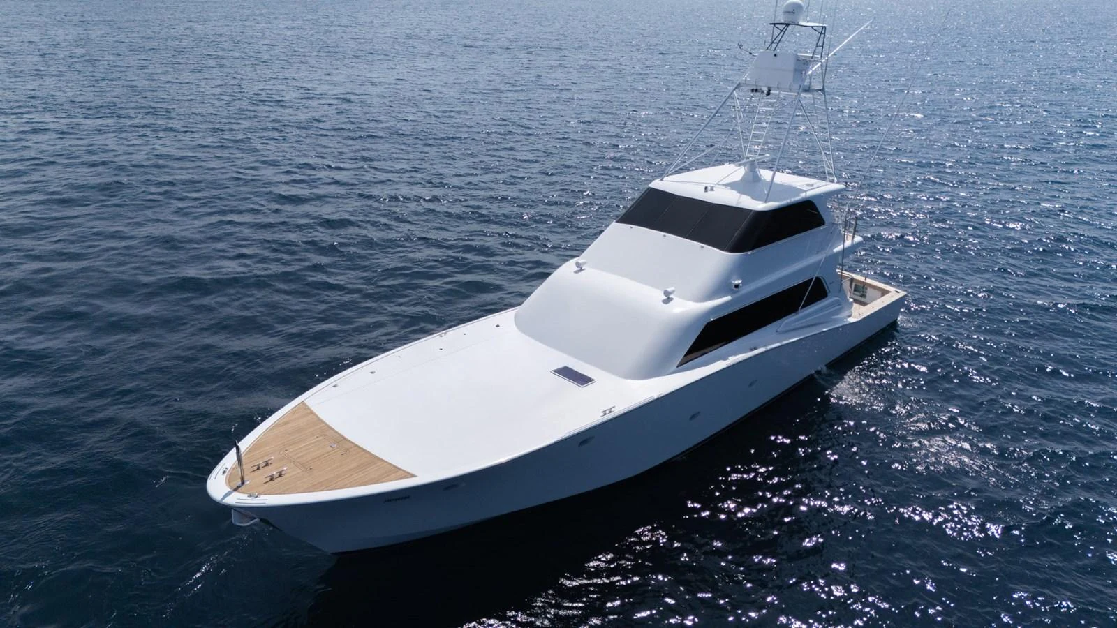 A sleek and modern yacht glides gracefully on the open water, showcasing its elegant design. aboard AUSSIE RULES Yacht for Sale