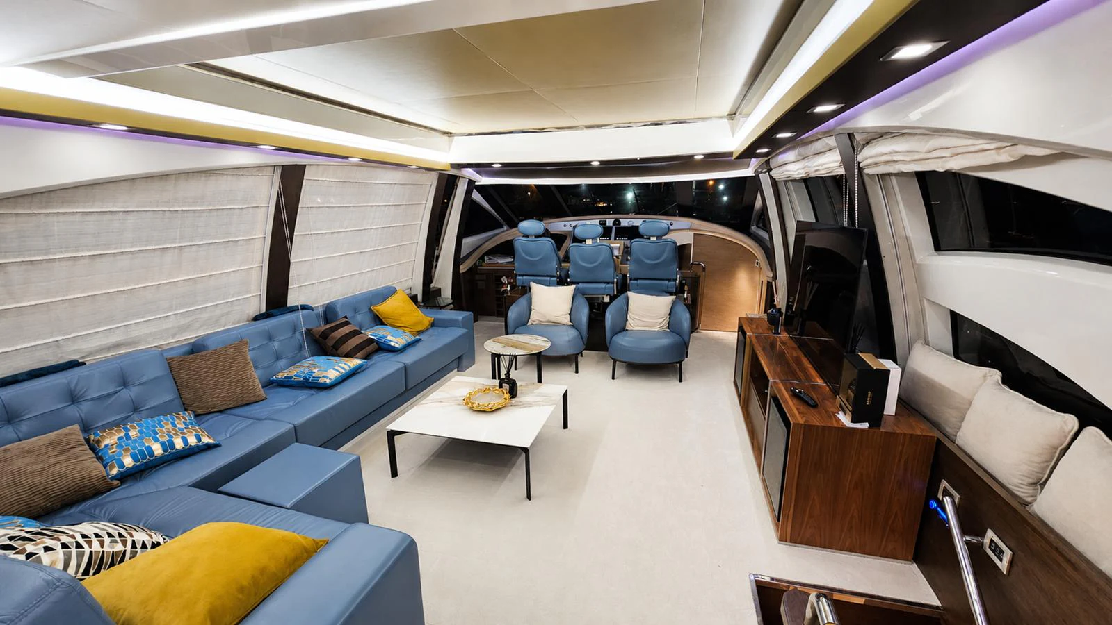 The salon features luxurious seating with modern decor and ample natural light. aboard AMAR T Yacht for Sale