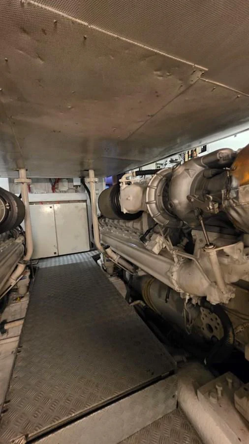 The image showcases the yacht's engine room with visible machinery and equipment. aboard AMAR T Yacht for Sale