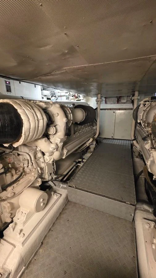 The image showcases the yacht's engine room with powerful machinery and a clean, organized layout. aboard AMAR T Yacht for Sale
