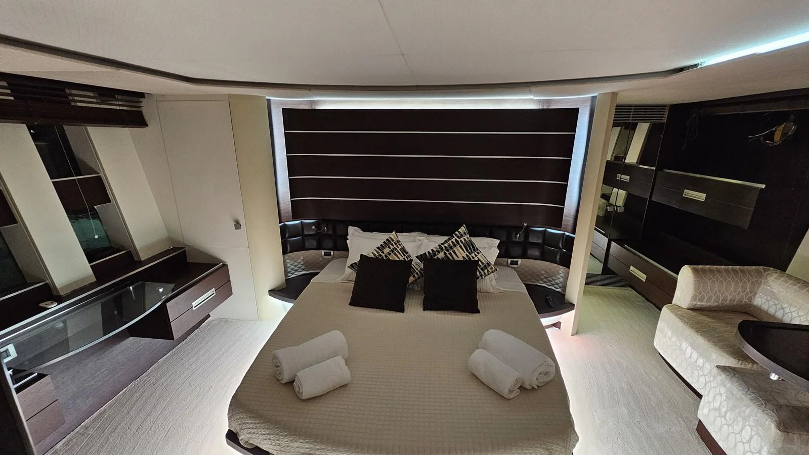 The master stateroom features a luxurious bed with plush pillows and modern decor. aboard AMAR T Yacht for Sale