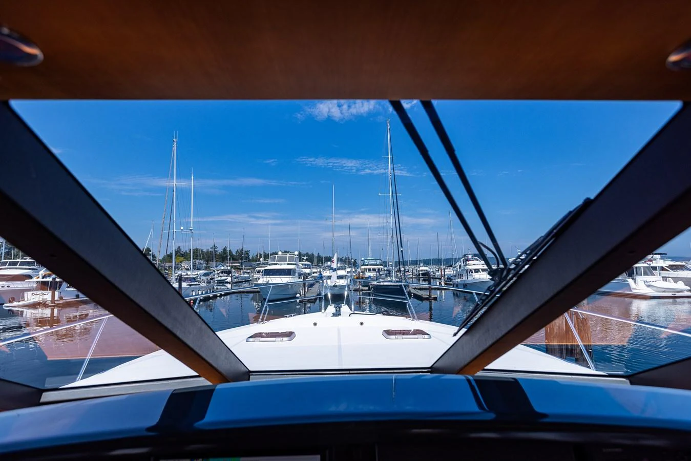 The helm offers a commanding view of the marina through large, angled windows. aboard DAWN TRADER VII Yacht for Sale