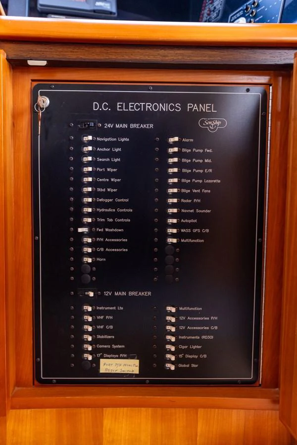 The yacht's DC electronics panel is neatly organized and clearly labeled for easy access and control. aboard DAWN TRADER VII Yacht for Sale