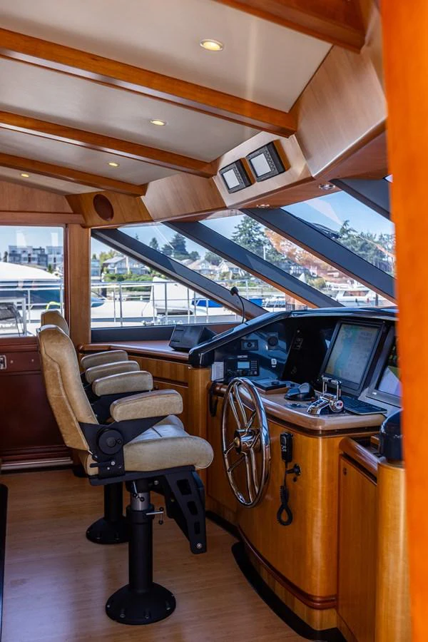 The helm station features state-of-the-art navigation equipment and luxurious seating. aboard DAWN TRADER VII Yacht for Sale