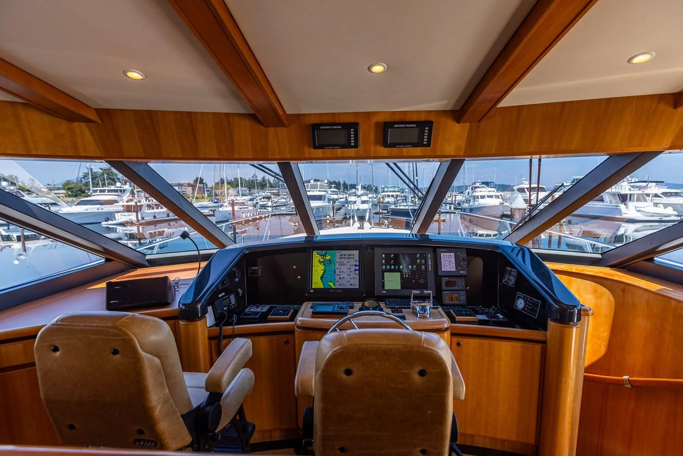 The helm station offers a commanding view with state-of-the-art navigation equipment and comfortable seating. aboard DAWN TRADER VII Yacht for Sale