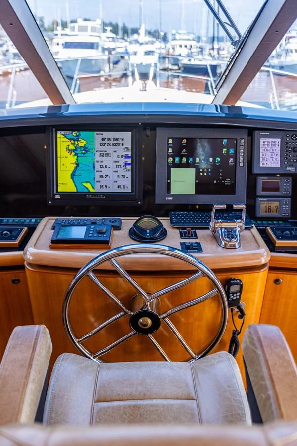 The helm features advanced navigation systems and a comfortable captain's chair, ensuring smooth and precise control. aboard DAWN TRADER VII Yacht for Sale