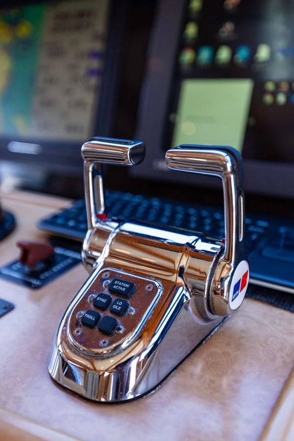 A close-up view of the yacht's helm controls, showcasing its modern and polished design. aboard DAWN TRADER VII Yacht for Sale