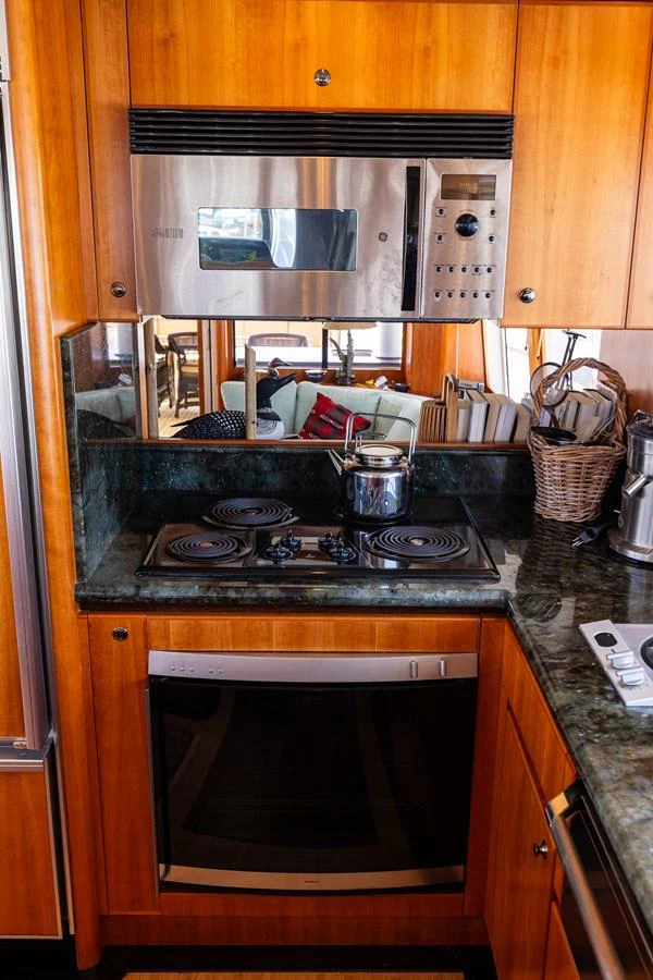 The yacht's galley features modern appliances and a cozy, efficient layout. aboard DAWN TRADER VII Yacht for Sale