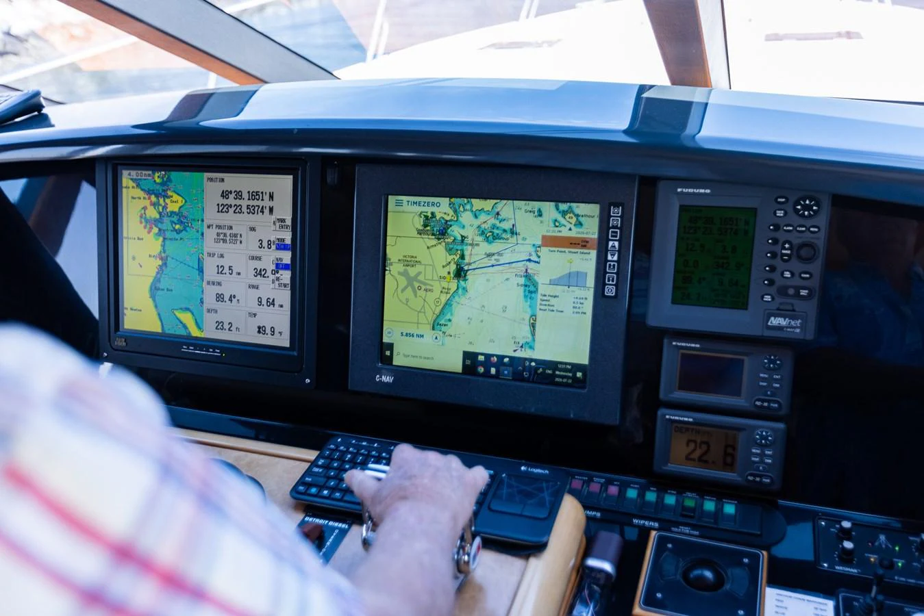 The helm station features advanced navigation equipment and controls. aboard DAWN TRADER VII Yacht for Sale