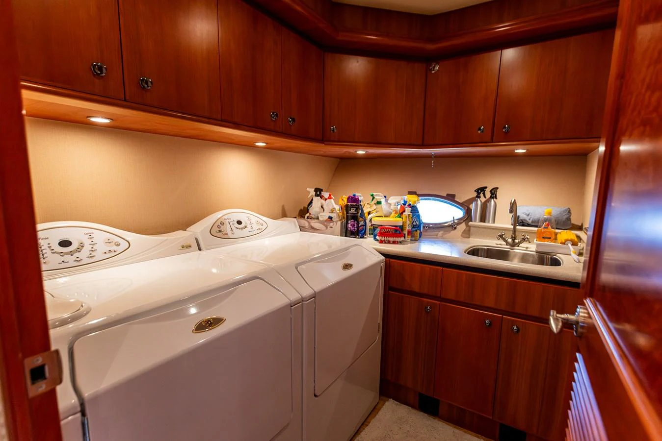 The yacht's laundry room is equipped with modern appliances and ample storage space. aboard DAWN TRADER VII Yacht for Sale