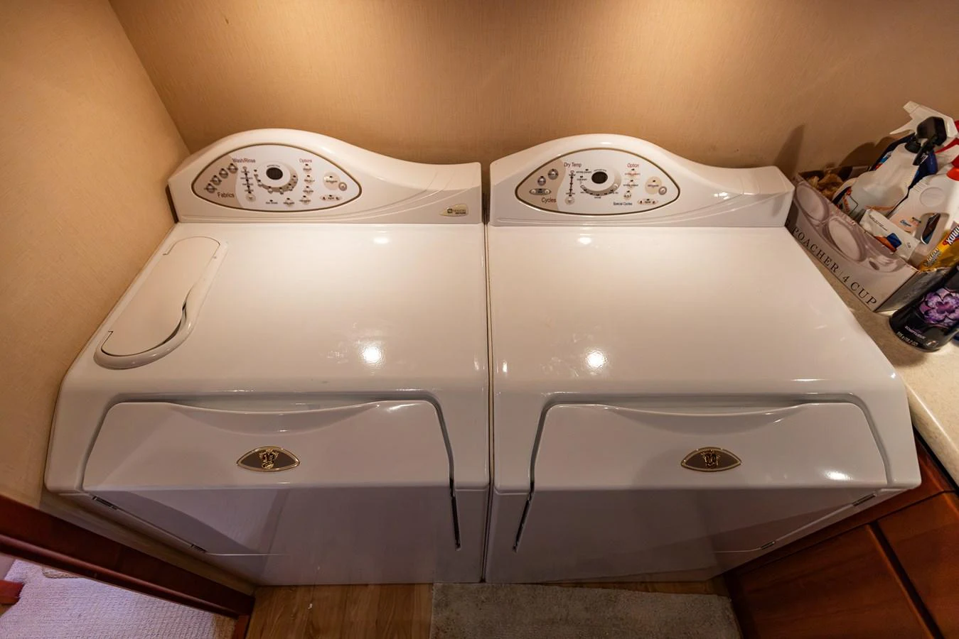 The yacht features a convenient laundry area with a washer and dryer. aboard DAWN TRADER VII Yacht for Sale