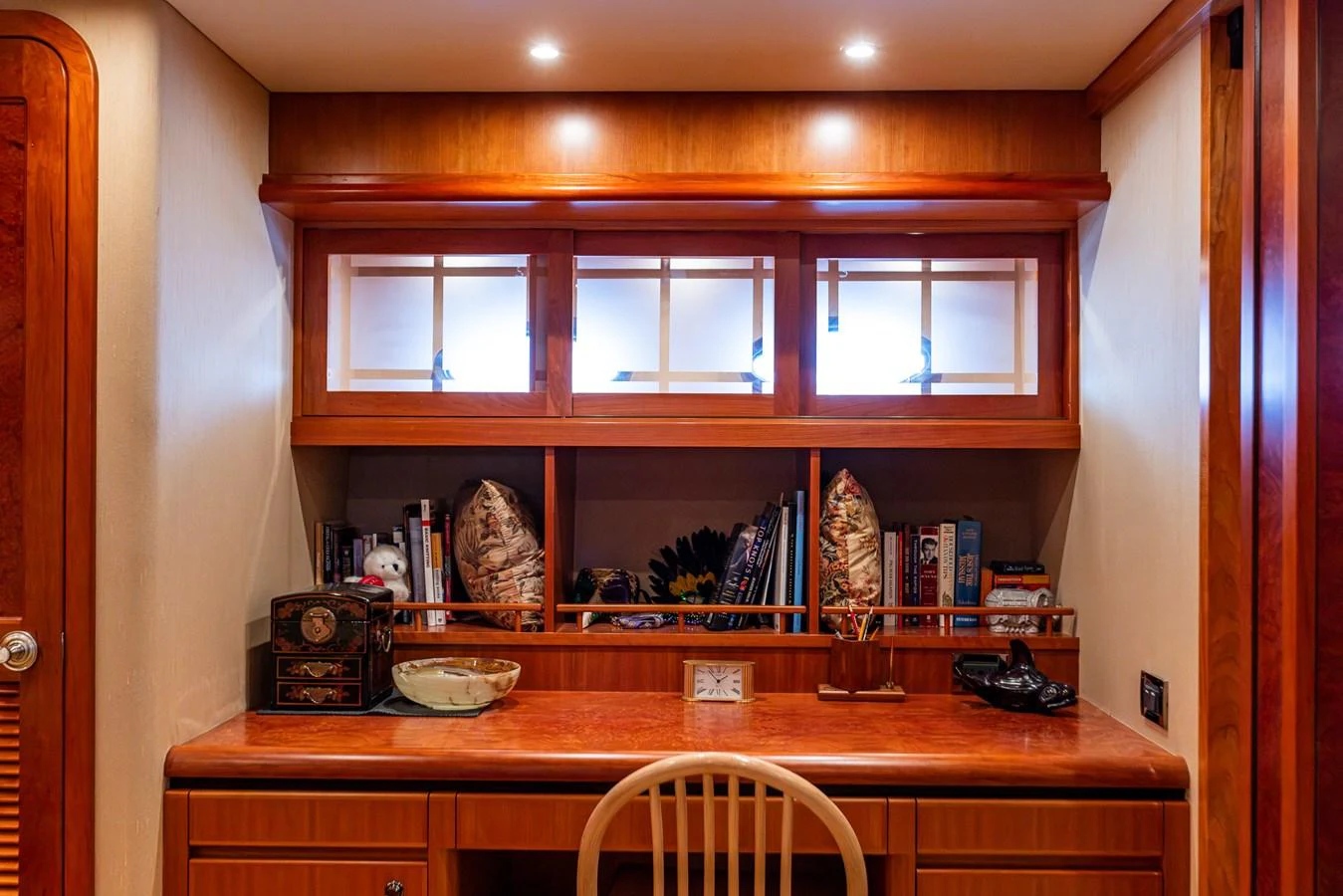 A cozy study area with wooden furnishings and ample storage space. aboard DAWN TRADER VII Yacht for Sale