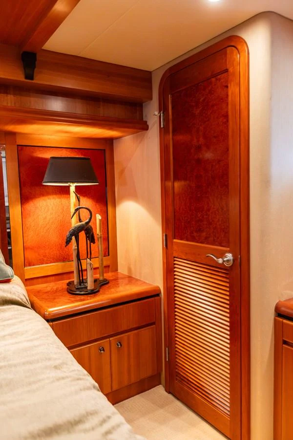 The yacht's interior features warm wooden finishes and elegant lighting. aboard DAWN TRADER VII Yacht for Sale